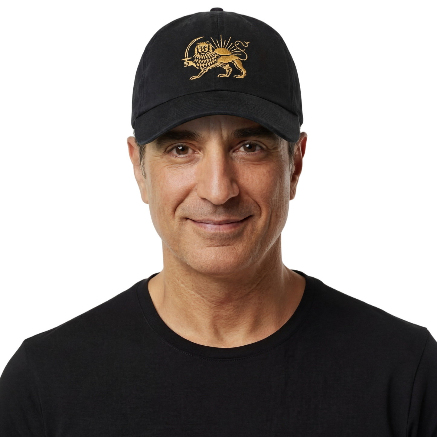 Man wearing a black cap with a gold emblem and a black t-shirt on a white background