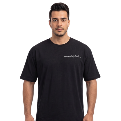 Man wearing a black t-shirt with text on a white background